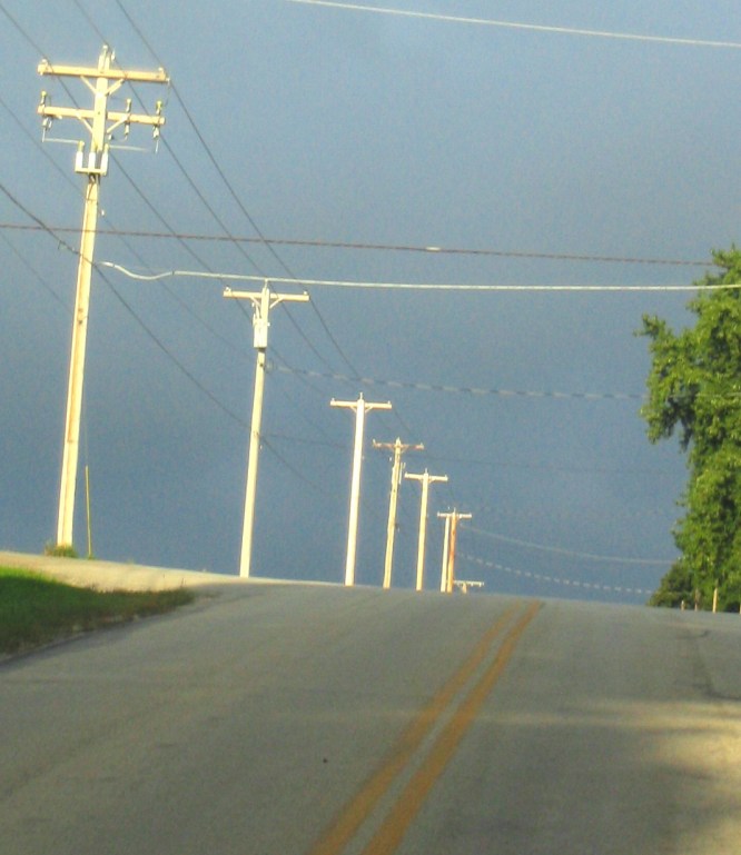hill-and-telephone-poles